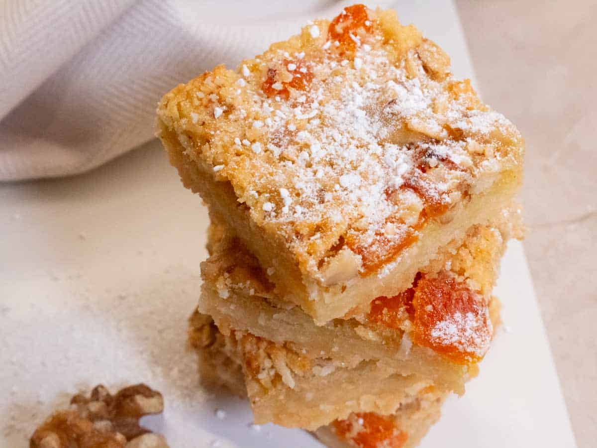 Apricot & Walnut Slices pilled up on a white plate